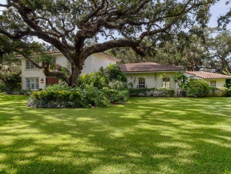 Hacienda beneath live oaks overlooks Old Riomar fairway