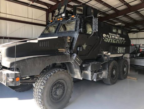 SWAT vehicle used to rescue woman from man firing shotgun