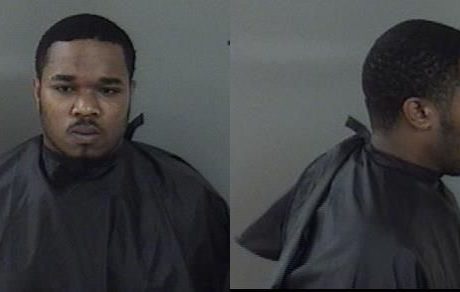 Man throws gasoline on another man, chases him with hammer