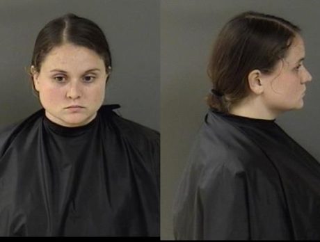 Woman charged after emaciated dog found in small cage