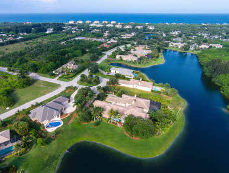 Custom River Club home offers lovely lakeside setting