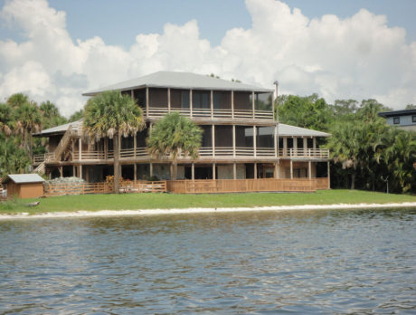 One-of-a-kind 3-story estate on 5 riverfront acres