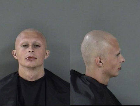 Man arrested after ramming car, flipping stolen vehicle