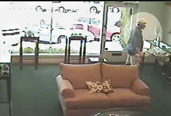 Police looking for two suspects in daring daytime armed robbery