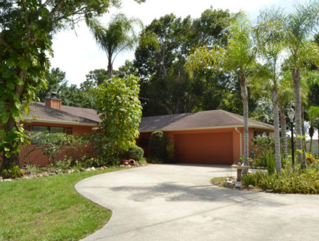 Updated pool home offers owners a private oasis