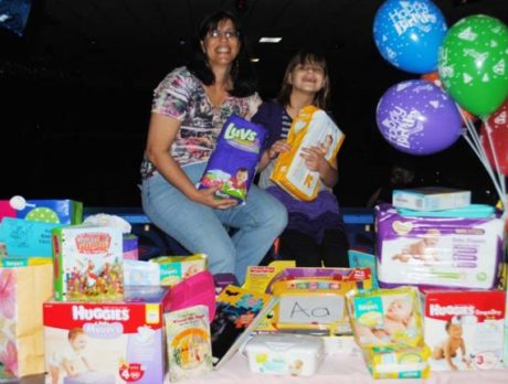 9-year-old girl delivers gifts to Healthy Start Coalition