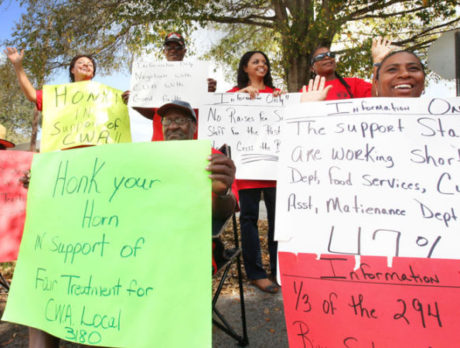 School District officials applaud janitor in midst of union picketing over pay
