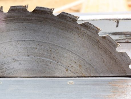 Construction worker rushed to hospital after cutting himself with saw