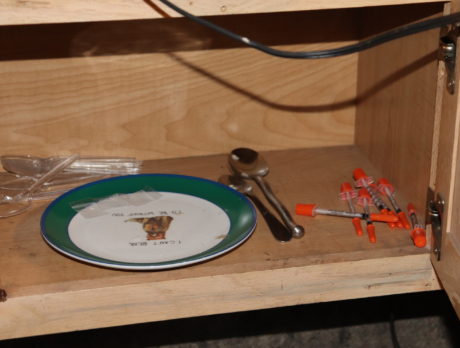 Search warrant nets 10 arrests in ‘drug den’