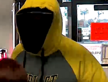 Deputies: Man behind black mask robs dollar store
