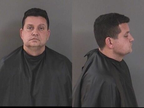 Man with gun charged after threats to shoot bar manager