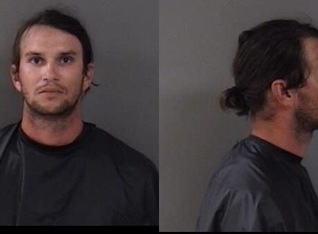Man charged after pulling gun on neighbor in dog dispute