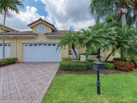 Exclusive Grand Harbor home features wide, green vistas