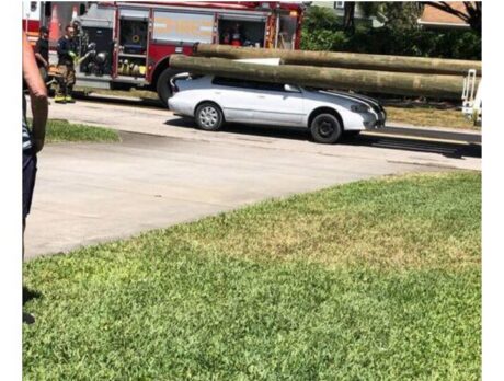 Telephone poles slam through car in rear-end collision