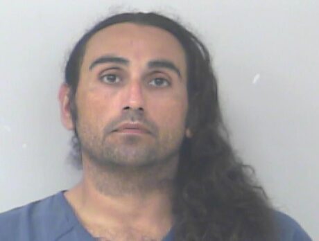 Man charged after stabbing associate several times in vehicle