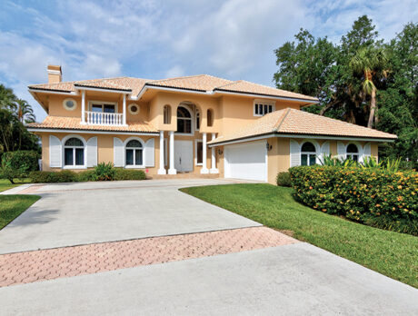 Spacious Orchid Isle Estates home overlooks conservation area