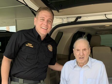 Drive-by parade honors WWII veteran’s 100th-birthday